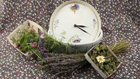 a clock and flowers are on the  fabric with a floral pattern, floristic composition