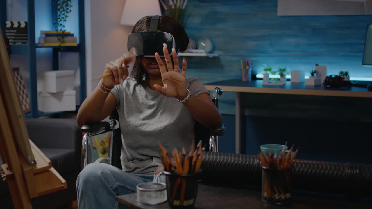 Woman artist of african american ethnicity using vr glasses