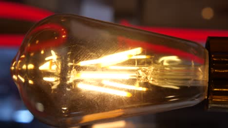 close up of a lit edison bulb