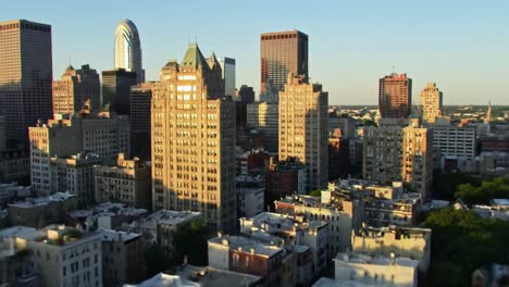 an aerial view capturing the stunning skyline of a bustling city, showcasing iconic architectural marvels and urban vibrancy at sunset