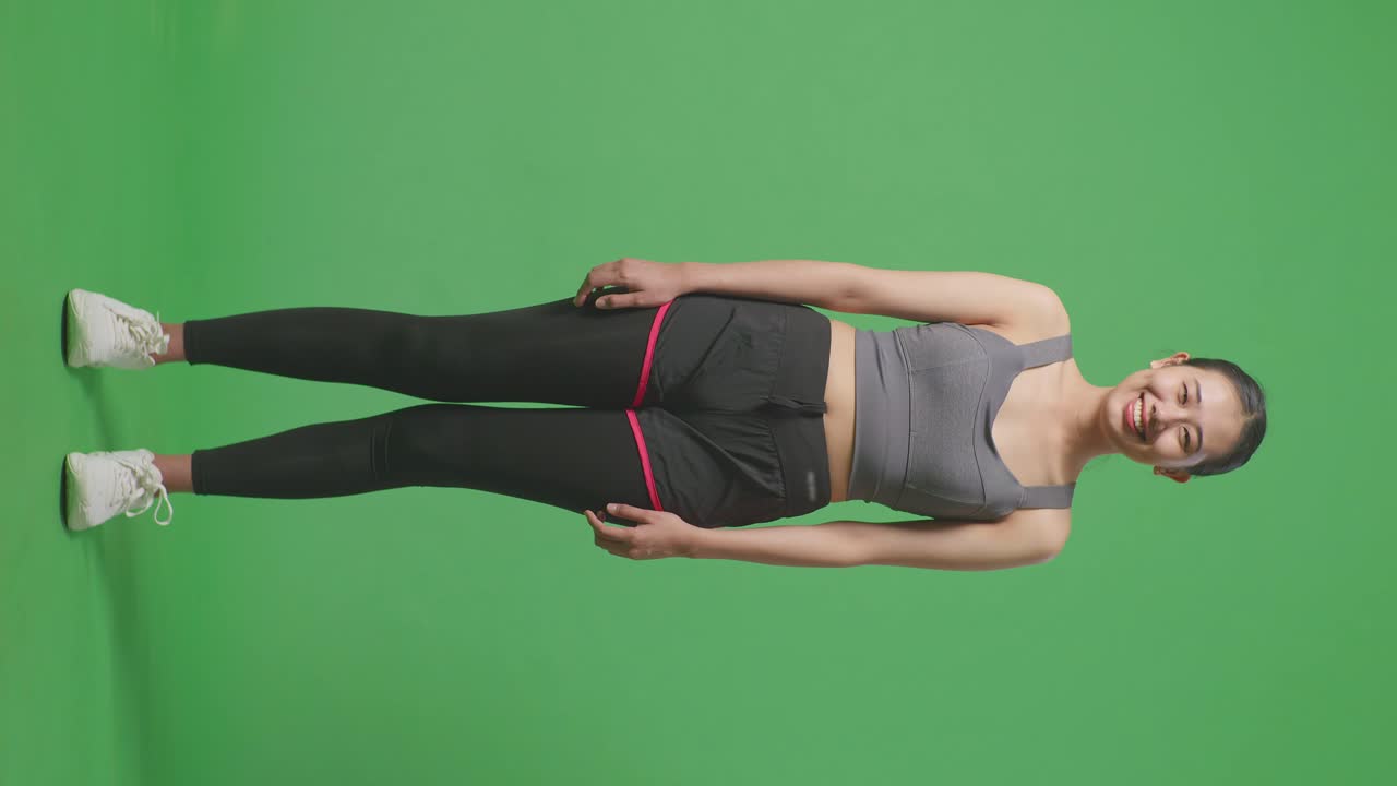 Donna in abbigliamento sportivo su green screen