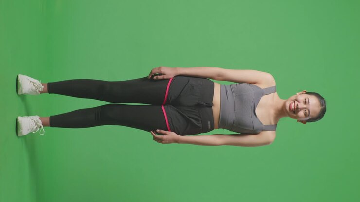 Donna in abbigliamento sportivo su green screen