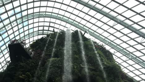 Waterfalls-Inside-The-Greenhouse-like-Glass-Dome-In-Cloud-Forest,-Singapore