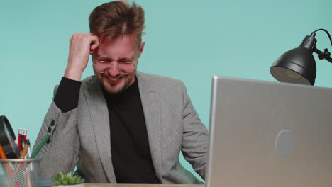 displeased business man rubbing temples to cure headache problem suffering from tension migraine