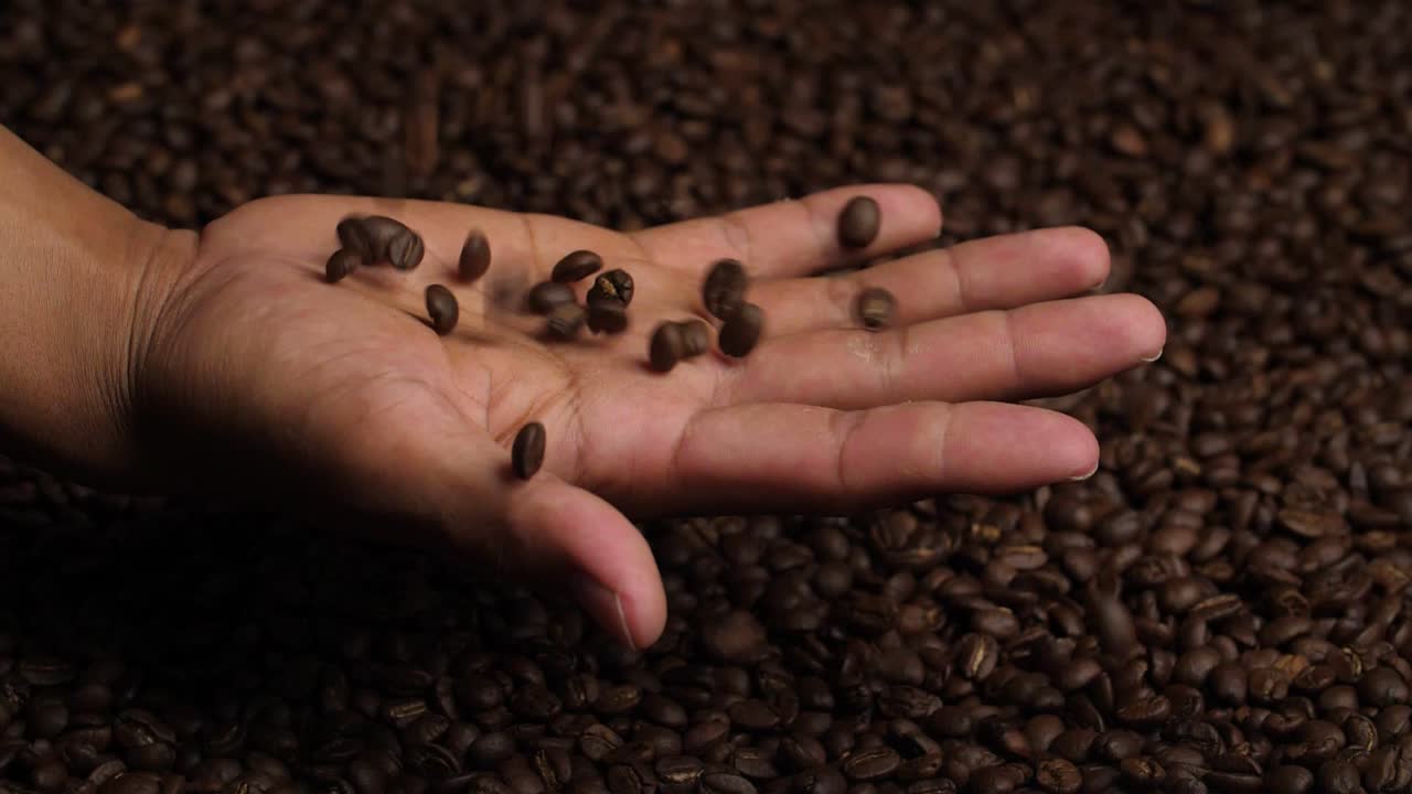 Coffee Beans Falling To Hand, Slow Motion