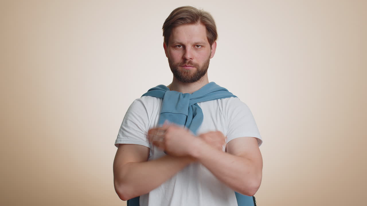 Frightened scared man closing his mouth with hand gestures no refusing to tell terrible secret