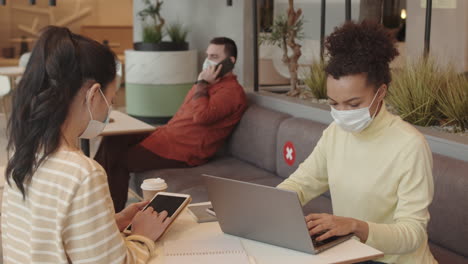 ladies working in modern lobby