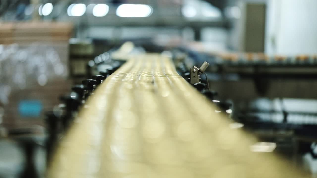 Golden cans in a beverage factory