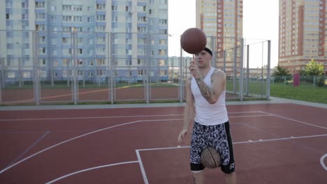 basketball player juggling balls on court