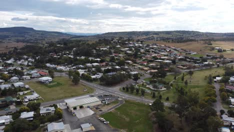 drone flying over a typical australian country town and an intersection below