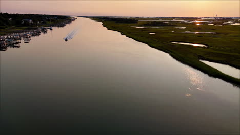 catching a small boat running down the icww at sunrise
