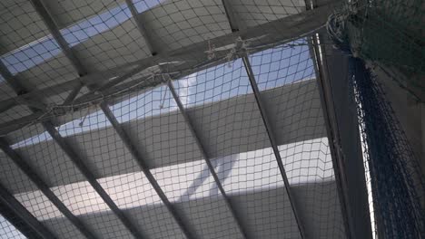 workers put up panels in the construction of the roof of an industrial building