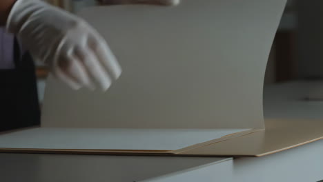 Handling Documents with Gloves in an Archival Setting