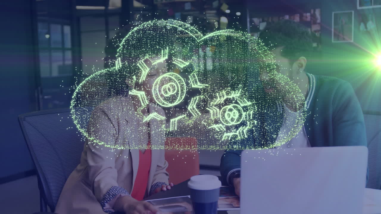 Cloud computing animation over business meeting with diverse professionals at office