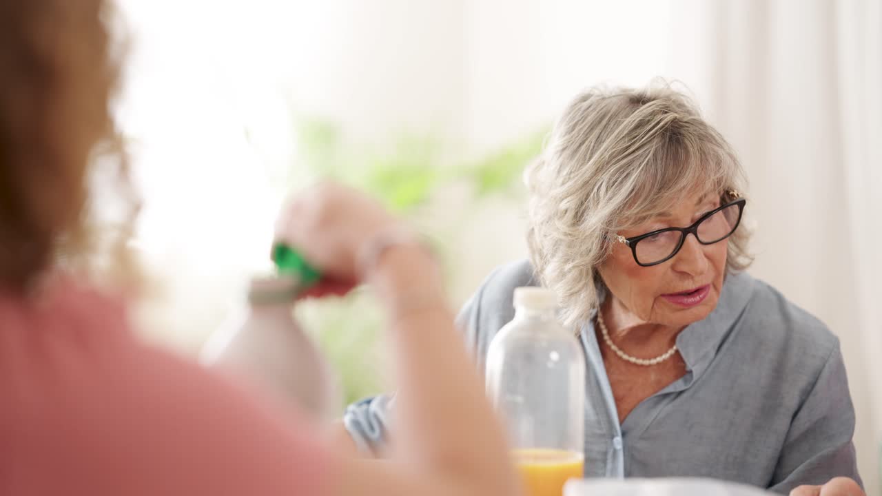 Senior Woman with Family at the Table
