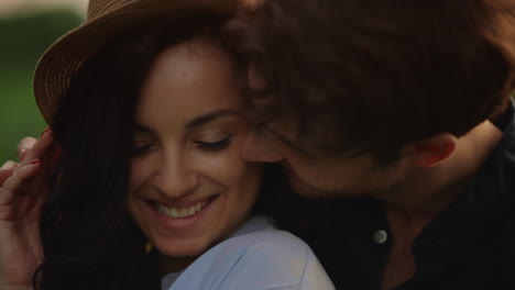 smiling couple expressing tenderness outdoors