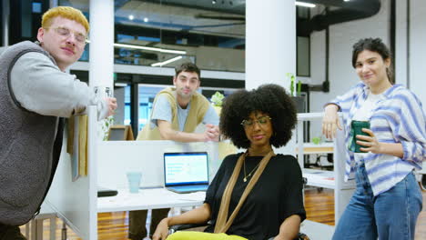 young business team posing together on camera in open space office