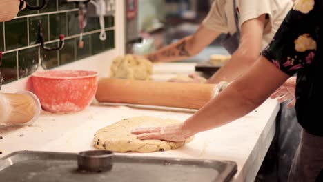 baker shaping dough in a cardiff market