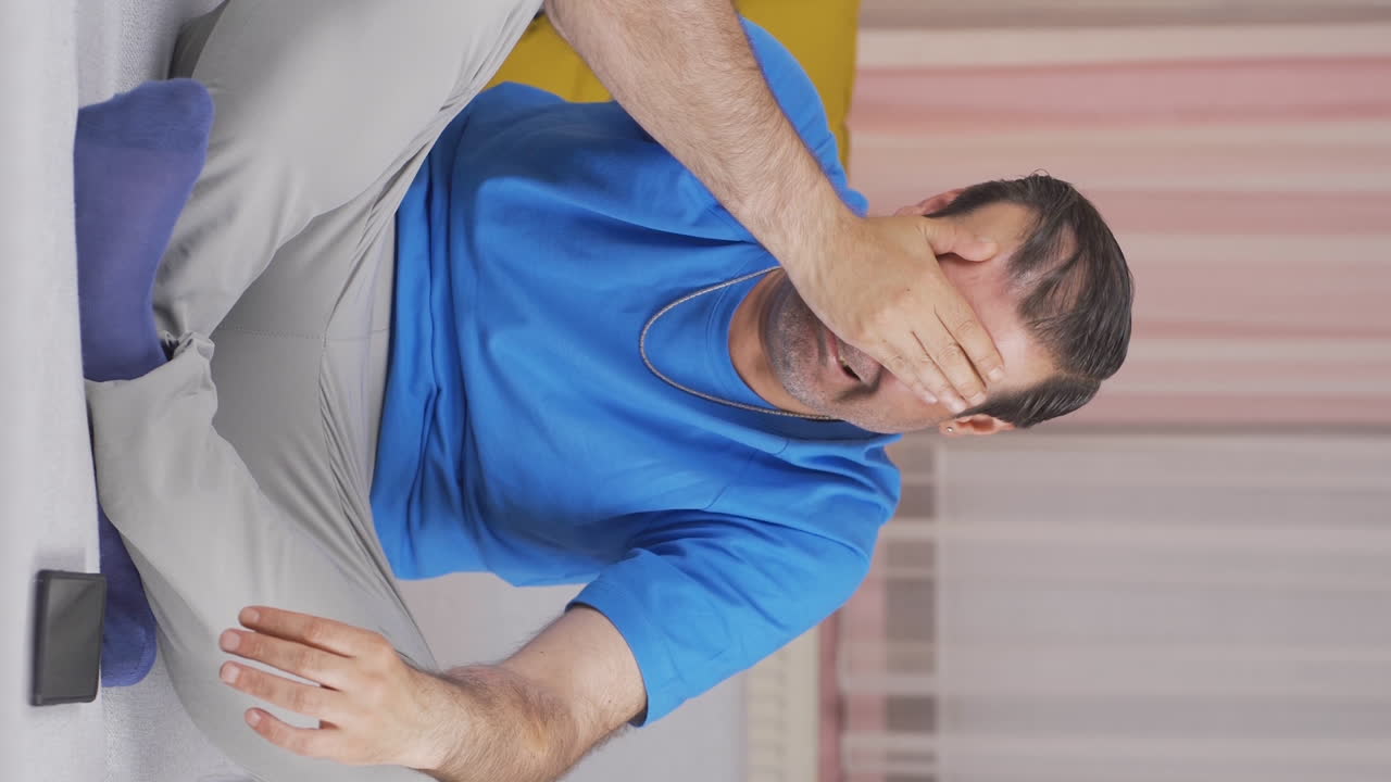 Vertical video of Man with Psychological Problems alone at home.