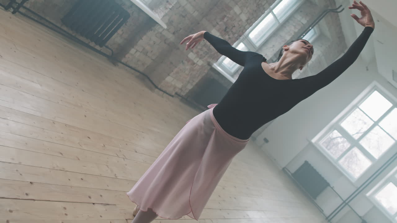 Talented Ballerina Dancing In Spacious Studio