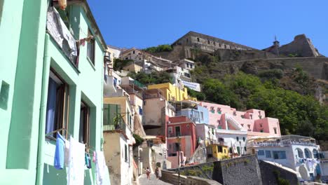 small town with pastel colored houses and terra murata walls on procida island