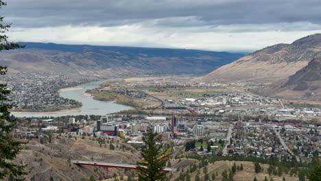 panoramic view of kamloops city with thompson river winding north.