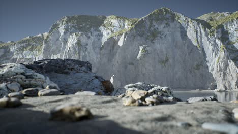 sand beach among rocks at atlantic ocean coast in portugal