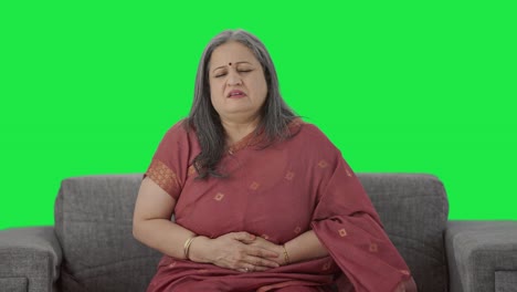 Sick-Indian-old-woman-suffering-from-stomach-pain-Green-screen