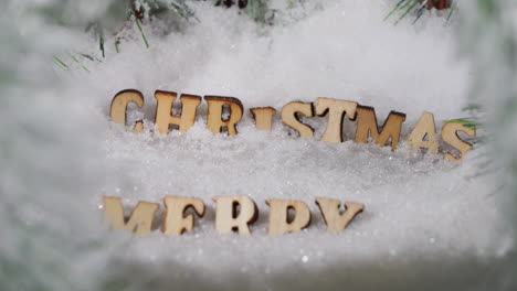 wooden text merry christmas in pure white snow