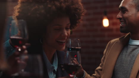 diverse group of friends drinking wine having fun in restaurant chatting sharing celebration enjoying socializing at evening reunion gathering