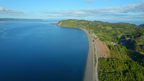 aerial view of the desolate beach of detif on lemuy island in the chiloe archipelago, chile on a sunny day