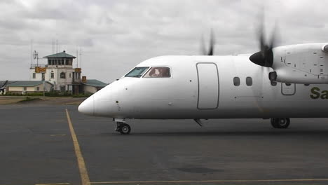 twin engine propplane on airport tarmac