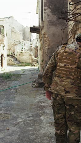 soldier checks the houses of a city devastated by bombings war