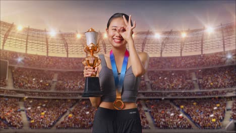 woman celebrating victory with a trophy in a stadium