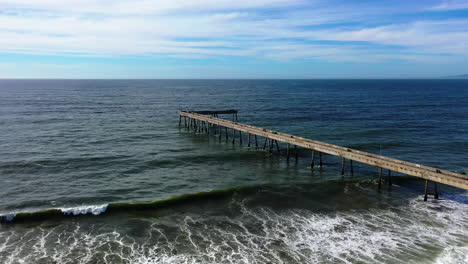 aerial view tilting toward the pacifica municipal pier in california, usa