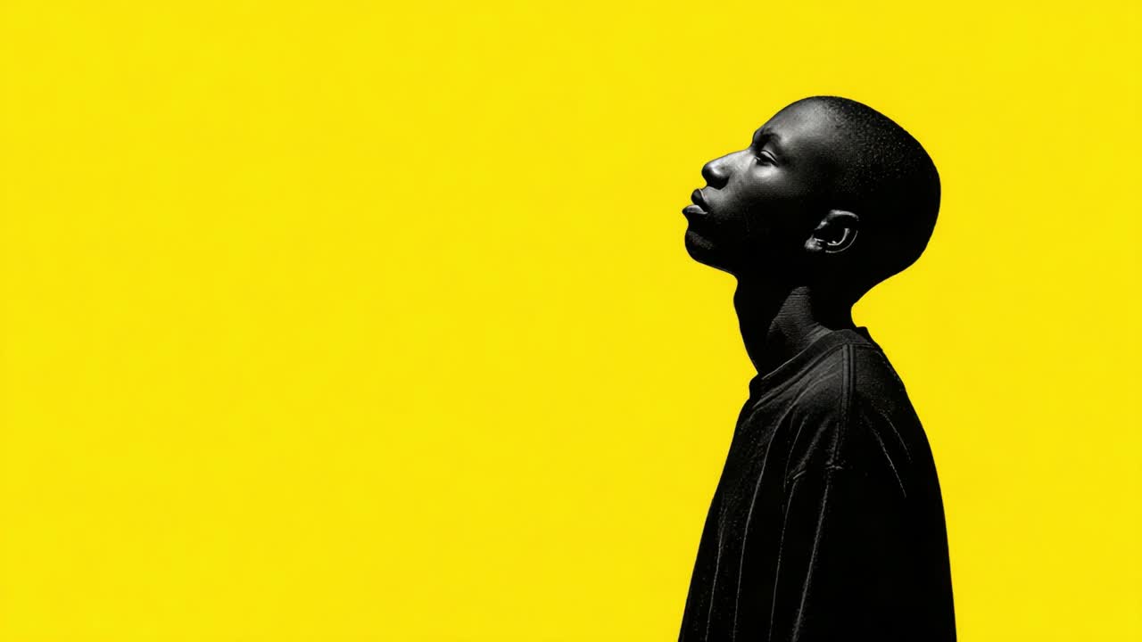 A Contemplative Profile Against a Bold Yellow Background: Exploring Identity and Emotion Through Portraiture in Two Distinct Frames