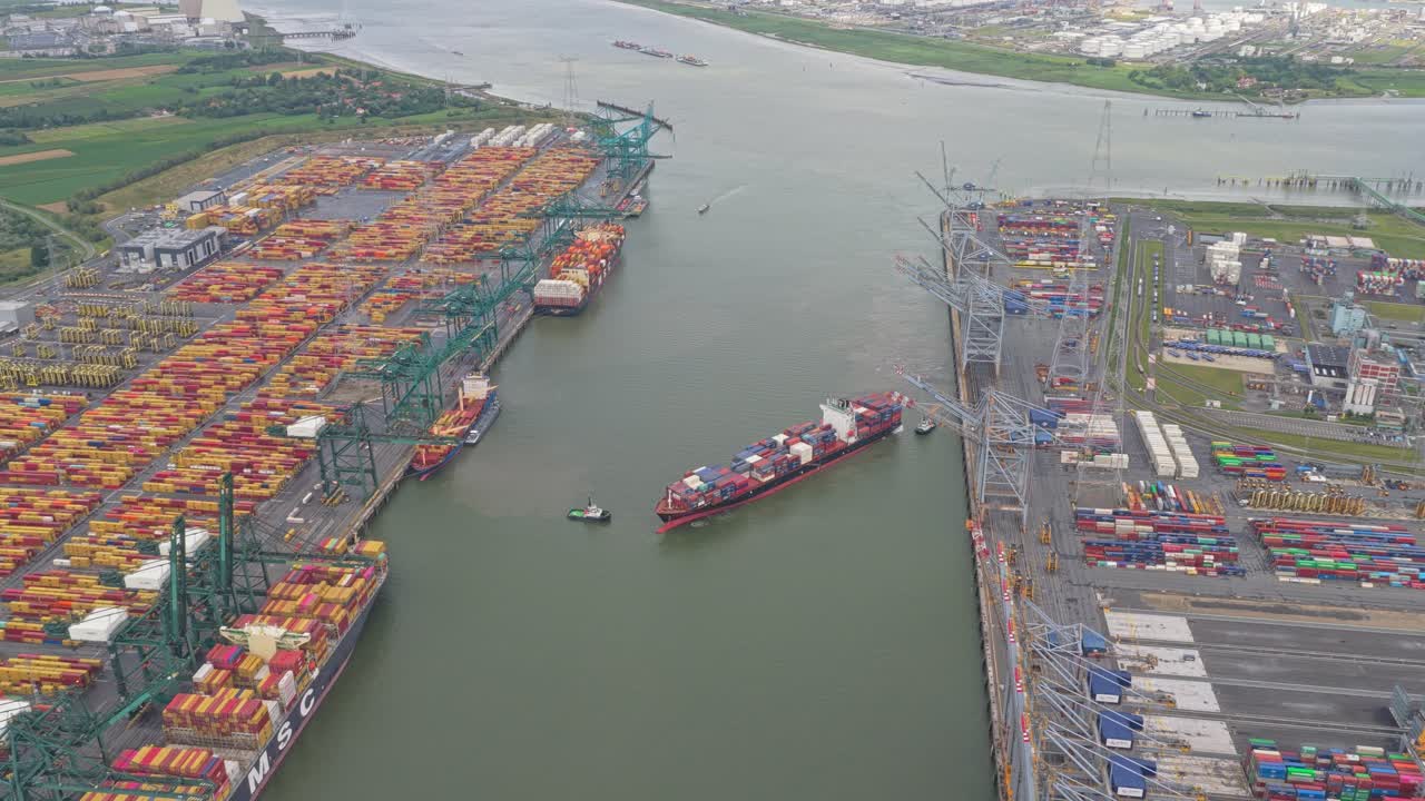 Busy cargo port aerial capture, container terminal with ships and cranes