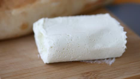 cream cheese on a cutting board