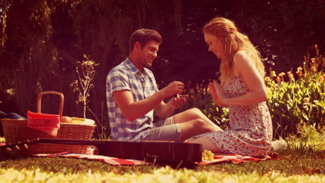 handsome man doing marriage proposal to his girlfriend