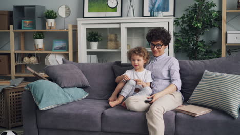 mother and child relaxing on sofa