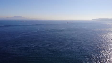 Aerial-Pan-Left-View-Of-The-Strait-Of-Gibraltar-With-Ships-In-Background