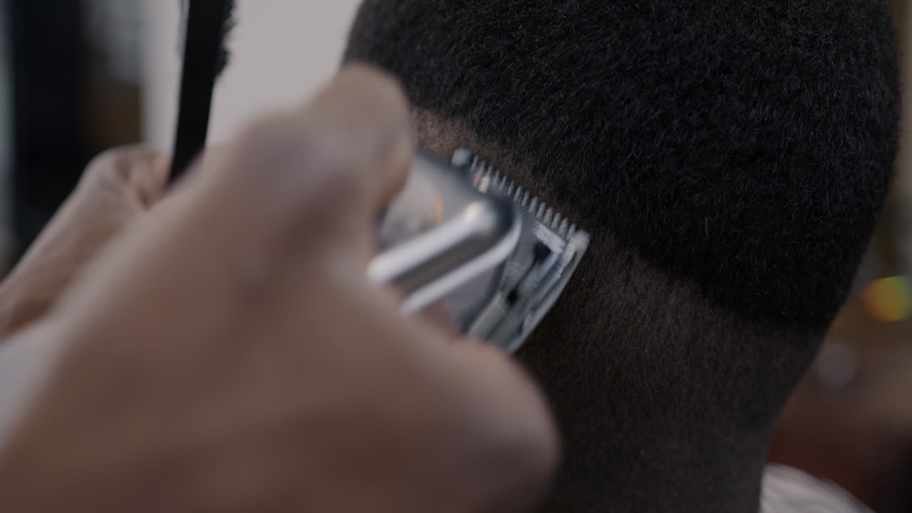 Close-up of a haircut being performed