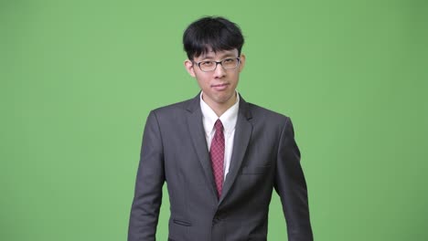 young asian businessman with stop gesture