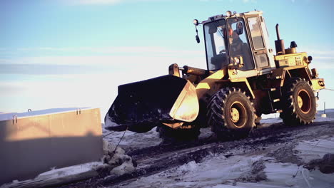 heavy equipment working in snowy conditions