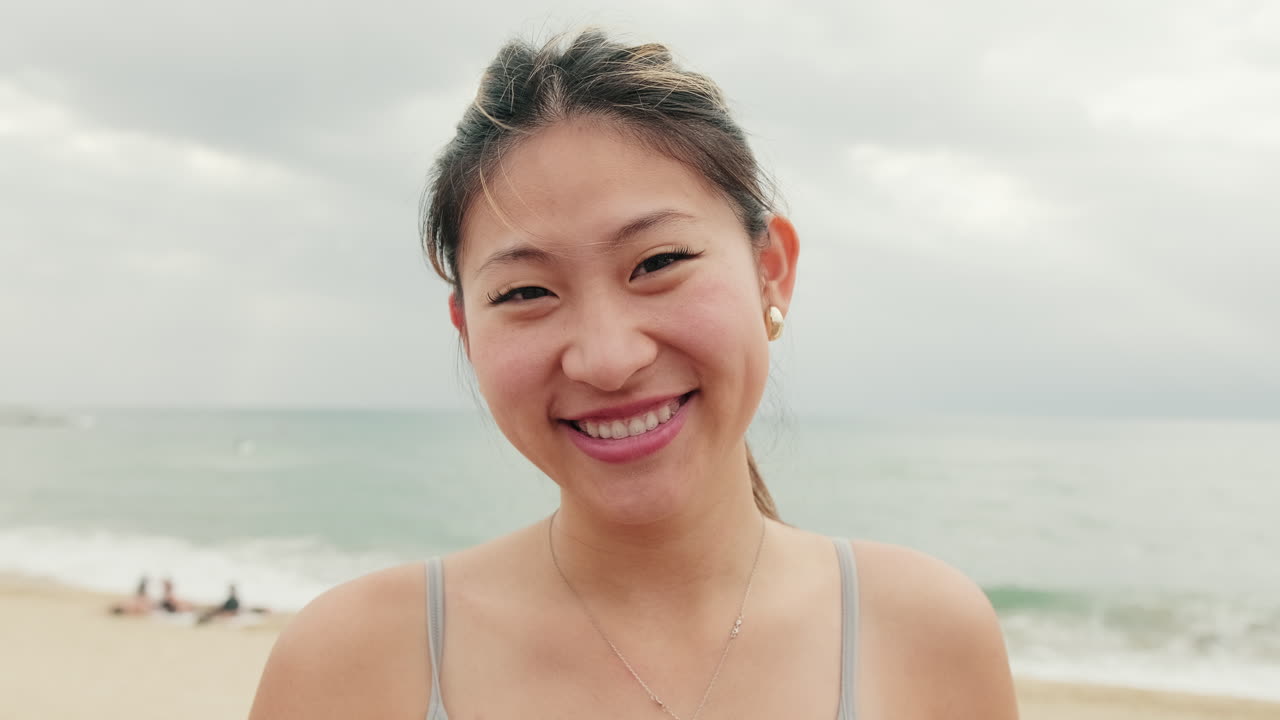 Smiling Asian Woman on the Beach