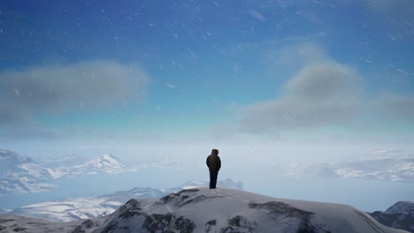 a person standing on top of a snow covered mountain. cold snowy landscape aerial view, unreal 4k a screenshot. zoom in past person