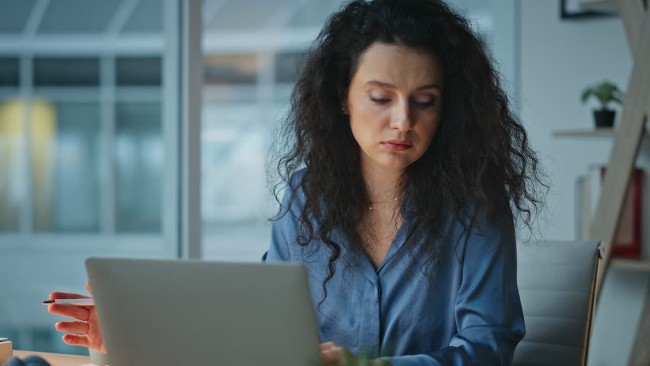 Thoughtful executive planning tasks working late. Closeup busy woman studying