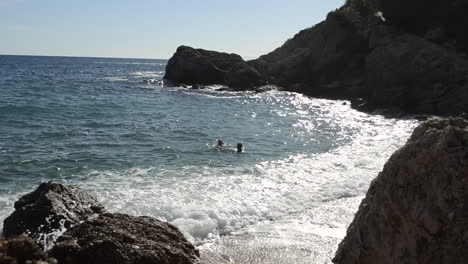 Couple-in-the-water-at-beach-in-Croatia