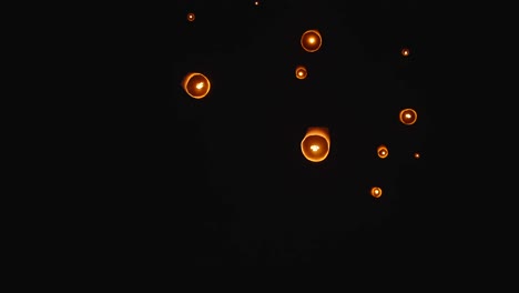 sky lanterns floating at night