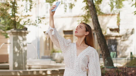 young woman tourist trying to catch a communication signal internet connection on mobile smartphone